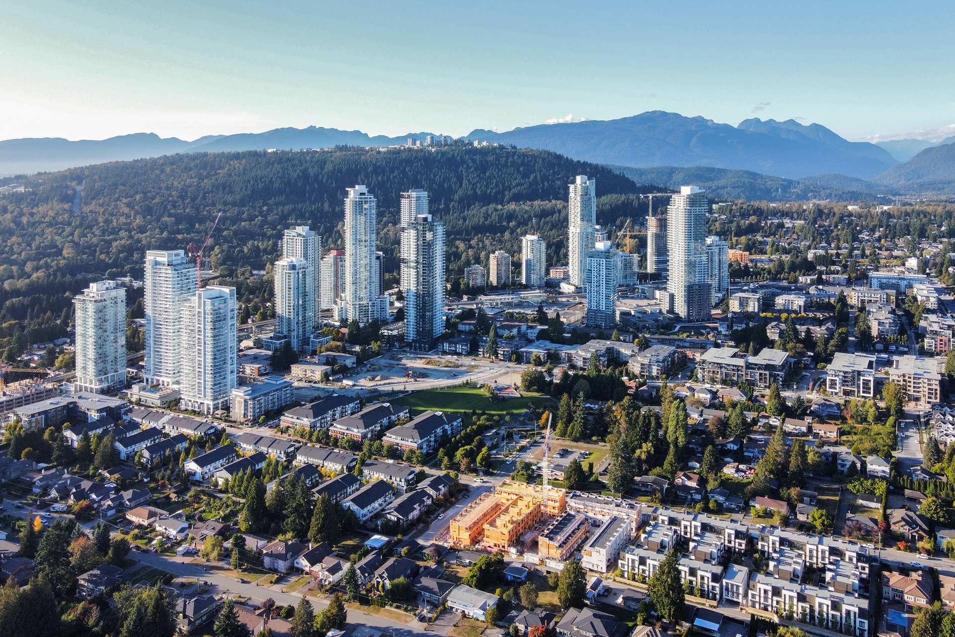 Aerial view of new towers rising over the single-family streets of Burquitlam, Coquitlam