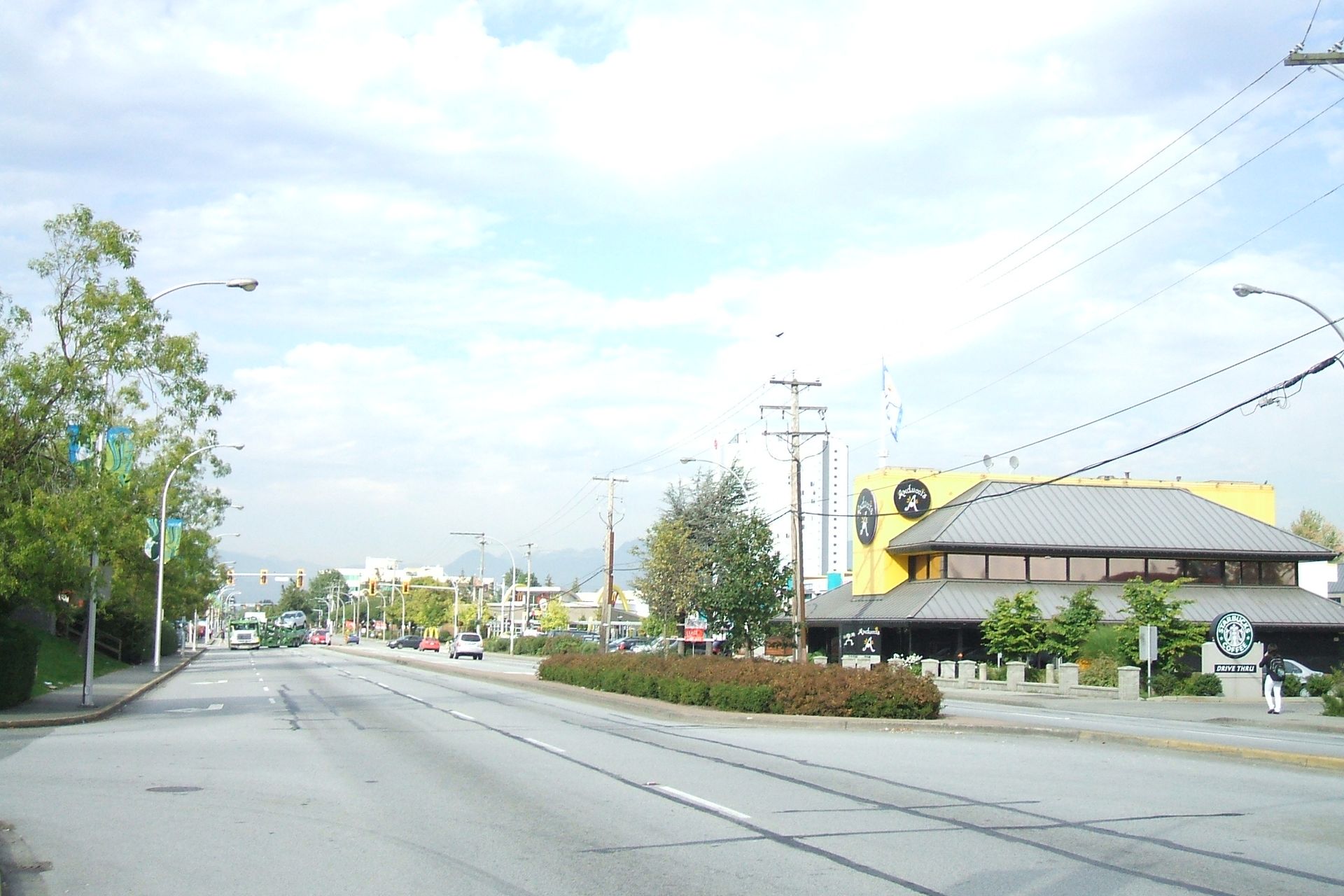 152 Street near Guildford Town Centre in Surrey, with shops along the road