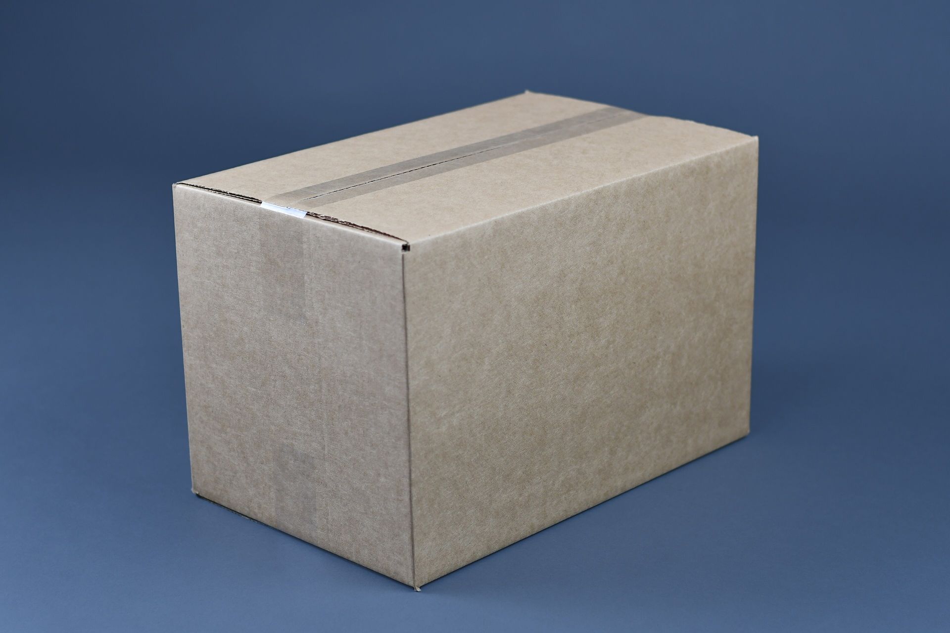 A cardboard moving box taped closed