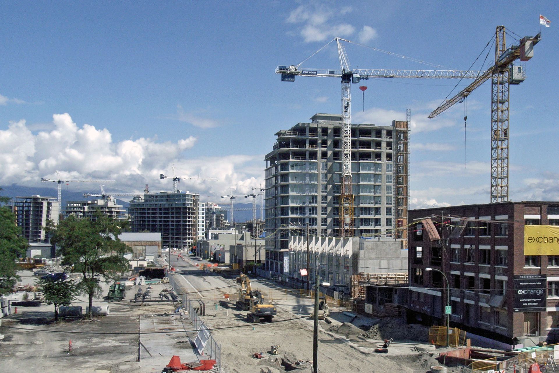 Tower cranes over condominium buildings under construction in Southeast False Creek, Vancouver