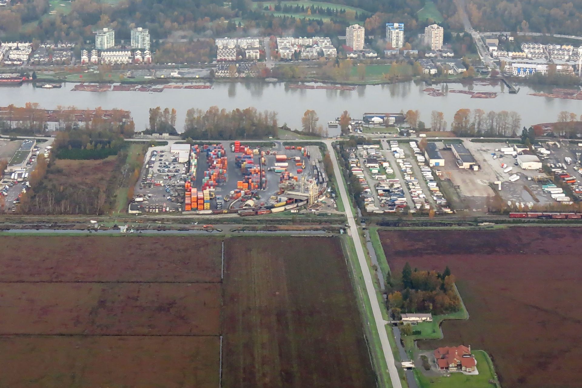 Aerial view of Richmond farmland and industry along the Fraser River
