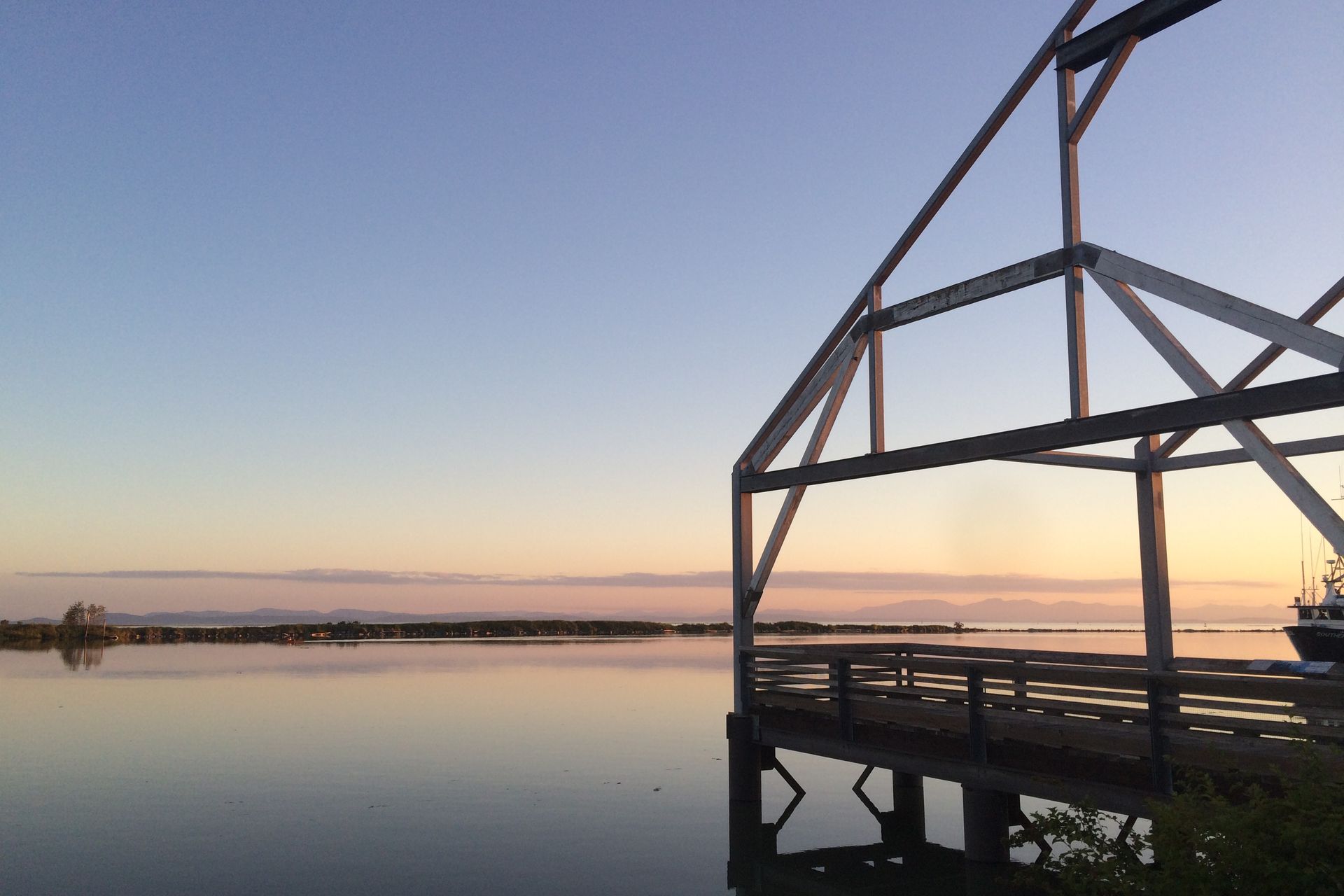 The Fraser River at dusk from the Steveston village boardwalk