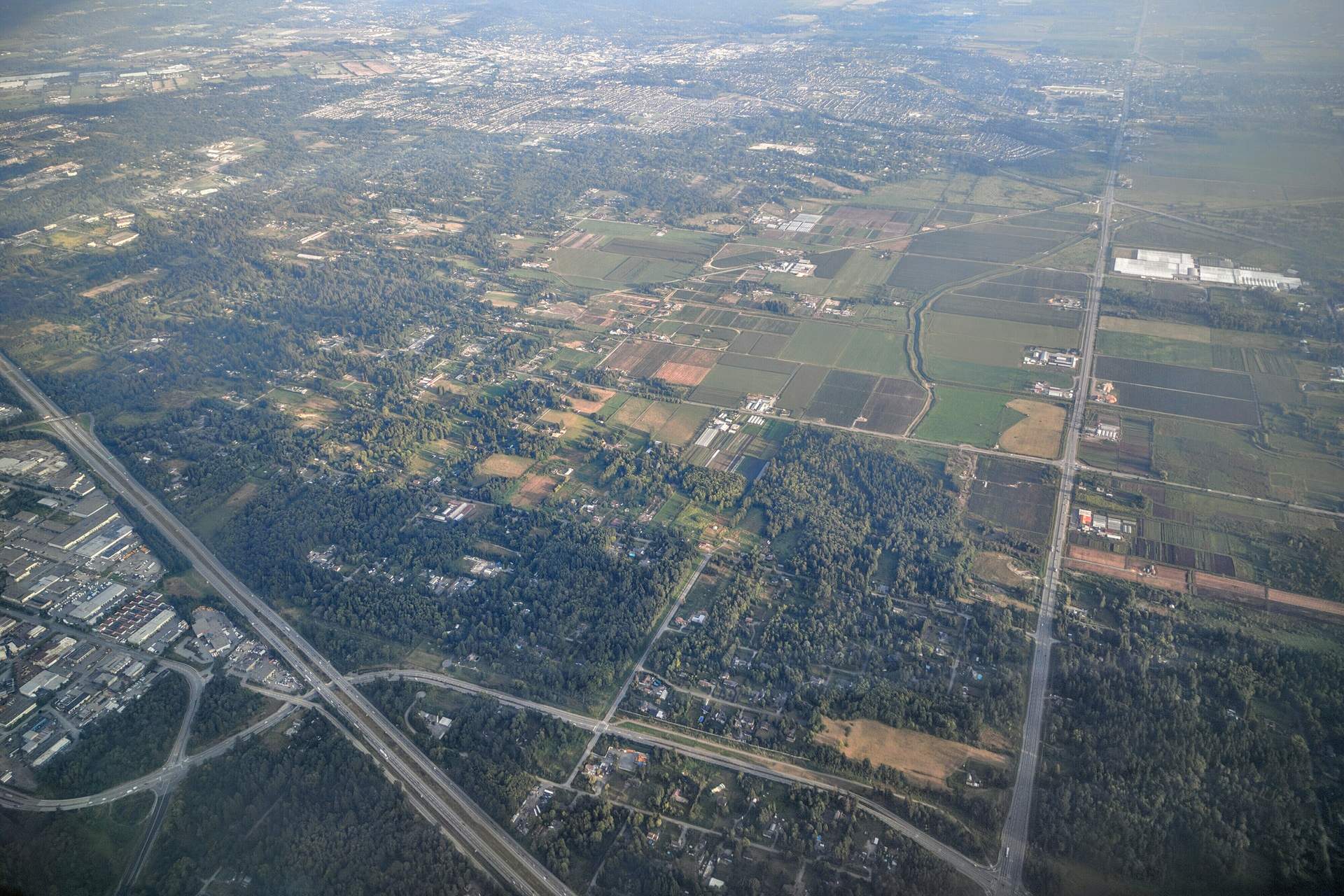 Aerial view south over Anniedale and the residential and rural lands of east Surrey