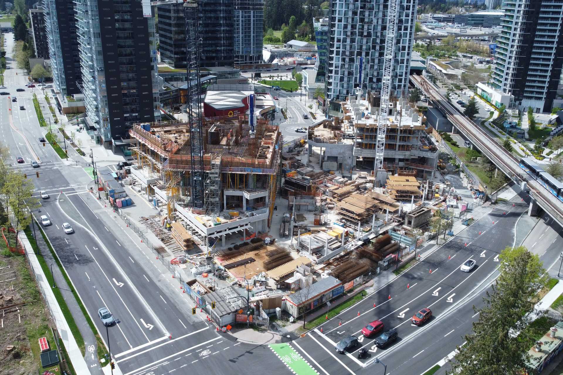 Aerial view of a mid-construction residential building at King George Hub in Surrey