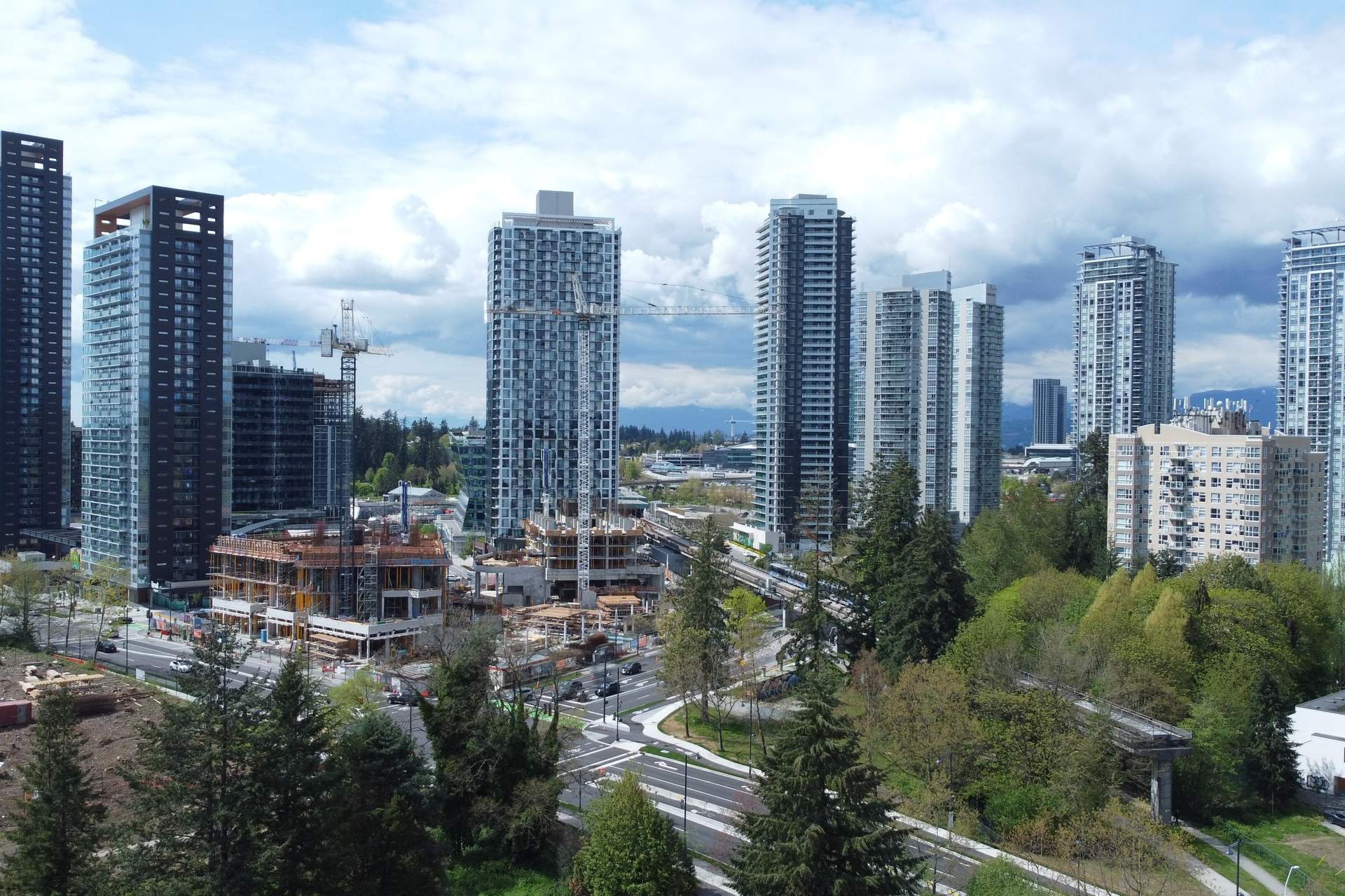 Condominium towers at King George Hub in Surrey City Centre, with new construction below