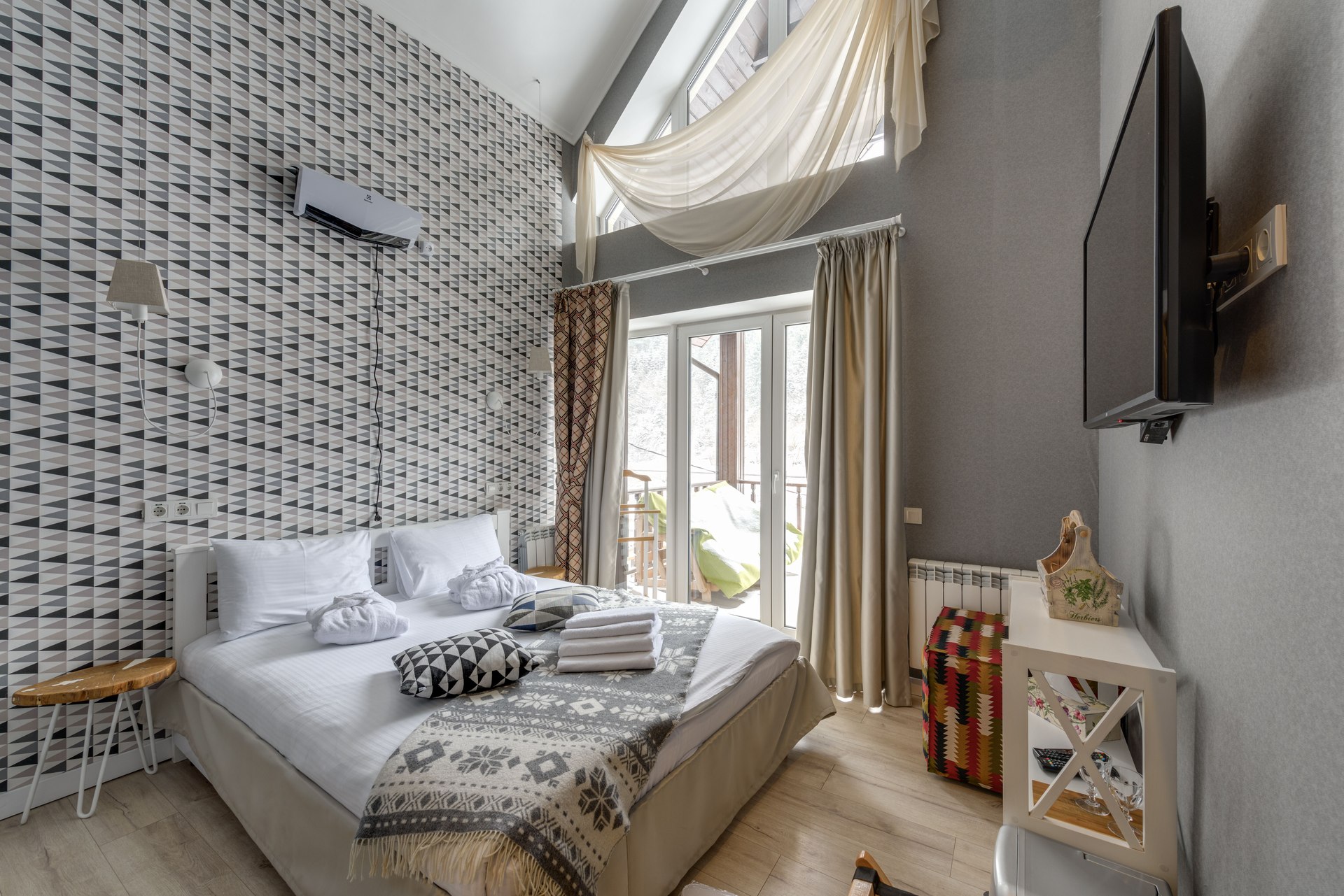 Calm bedroom with patterned bedding and natural light