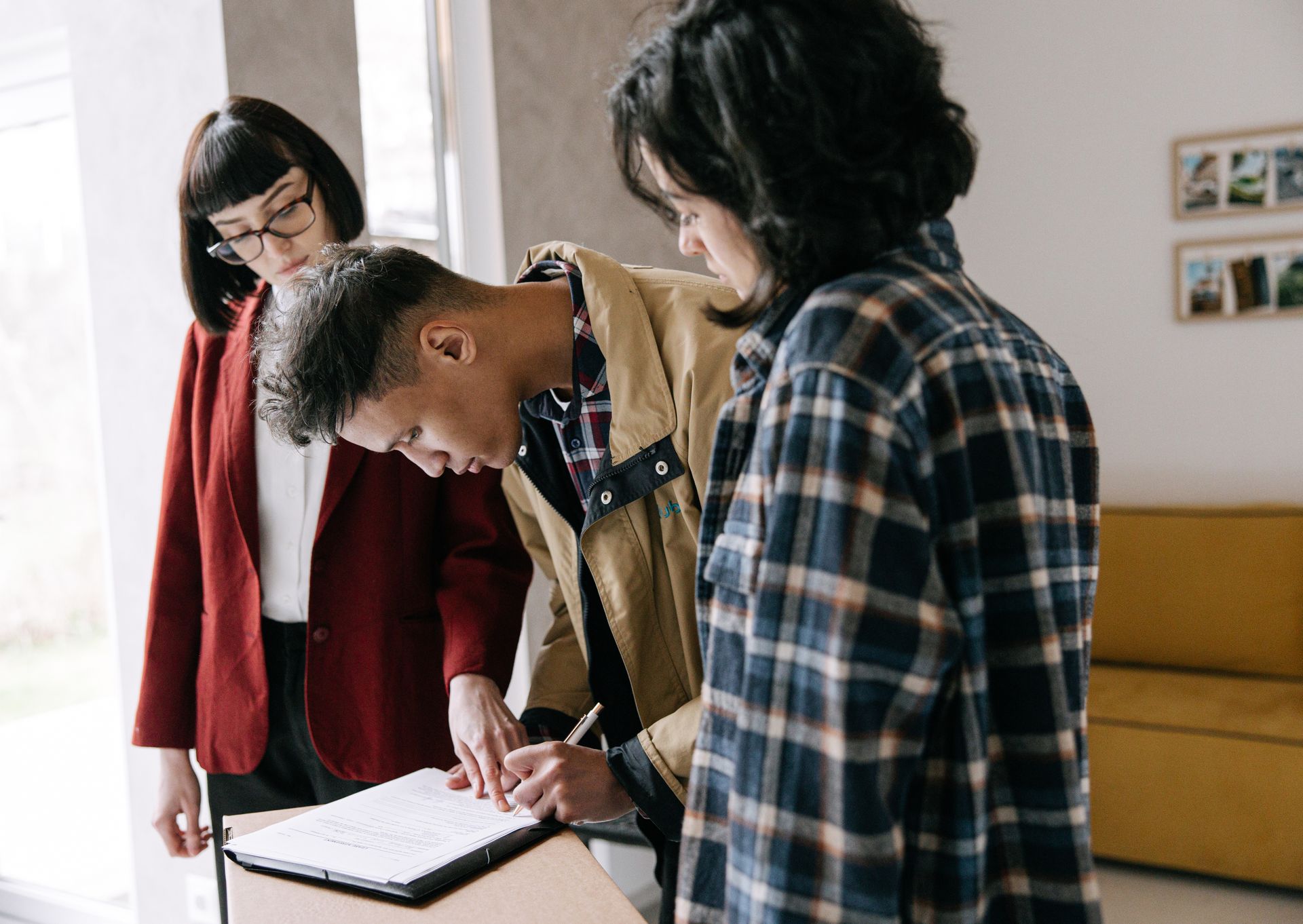 Buyers reviewing documents with their advisor
