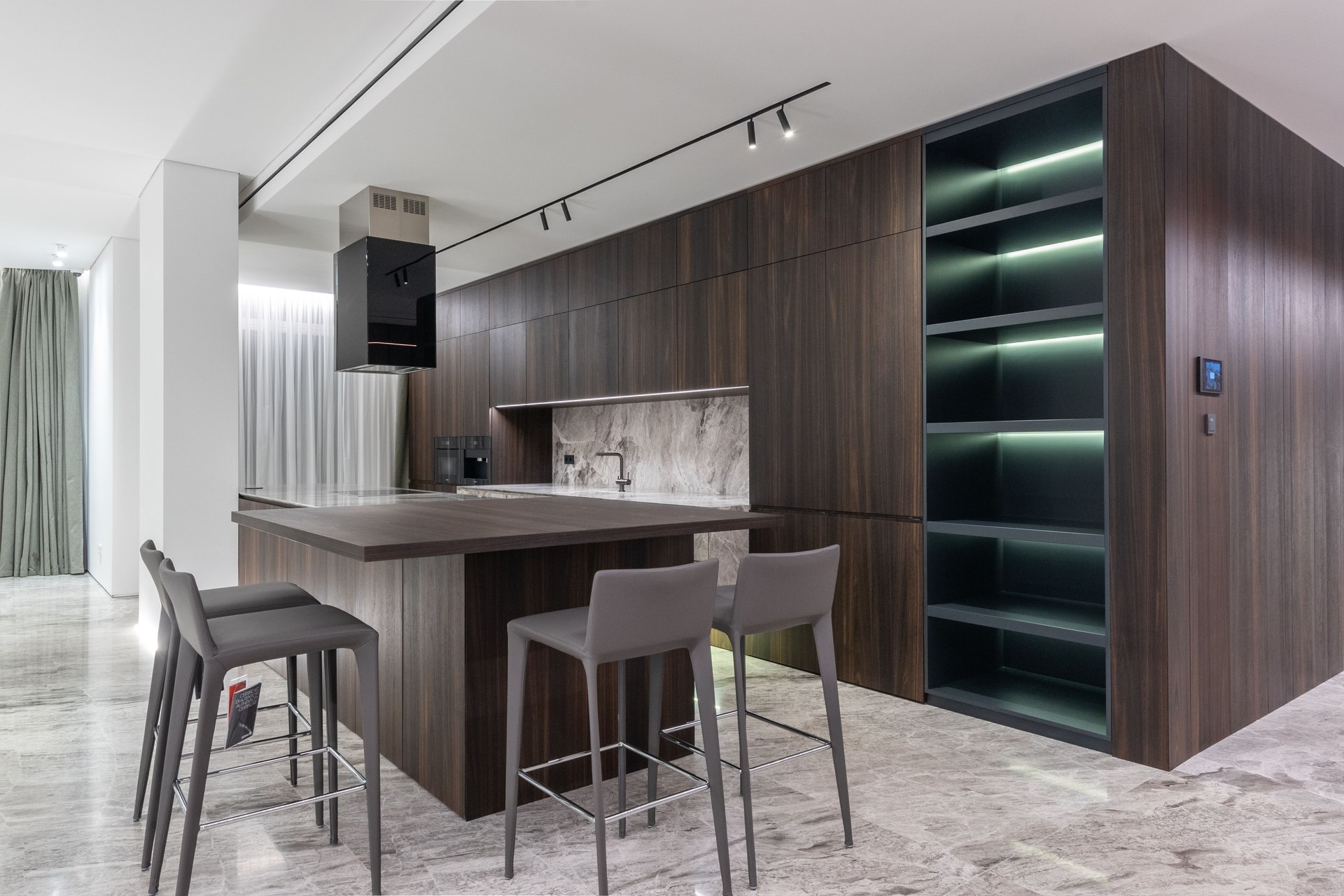 Contemporary kitchen with an island and pendant lights